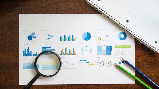 Magnifying glass looking at graphs